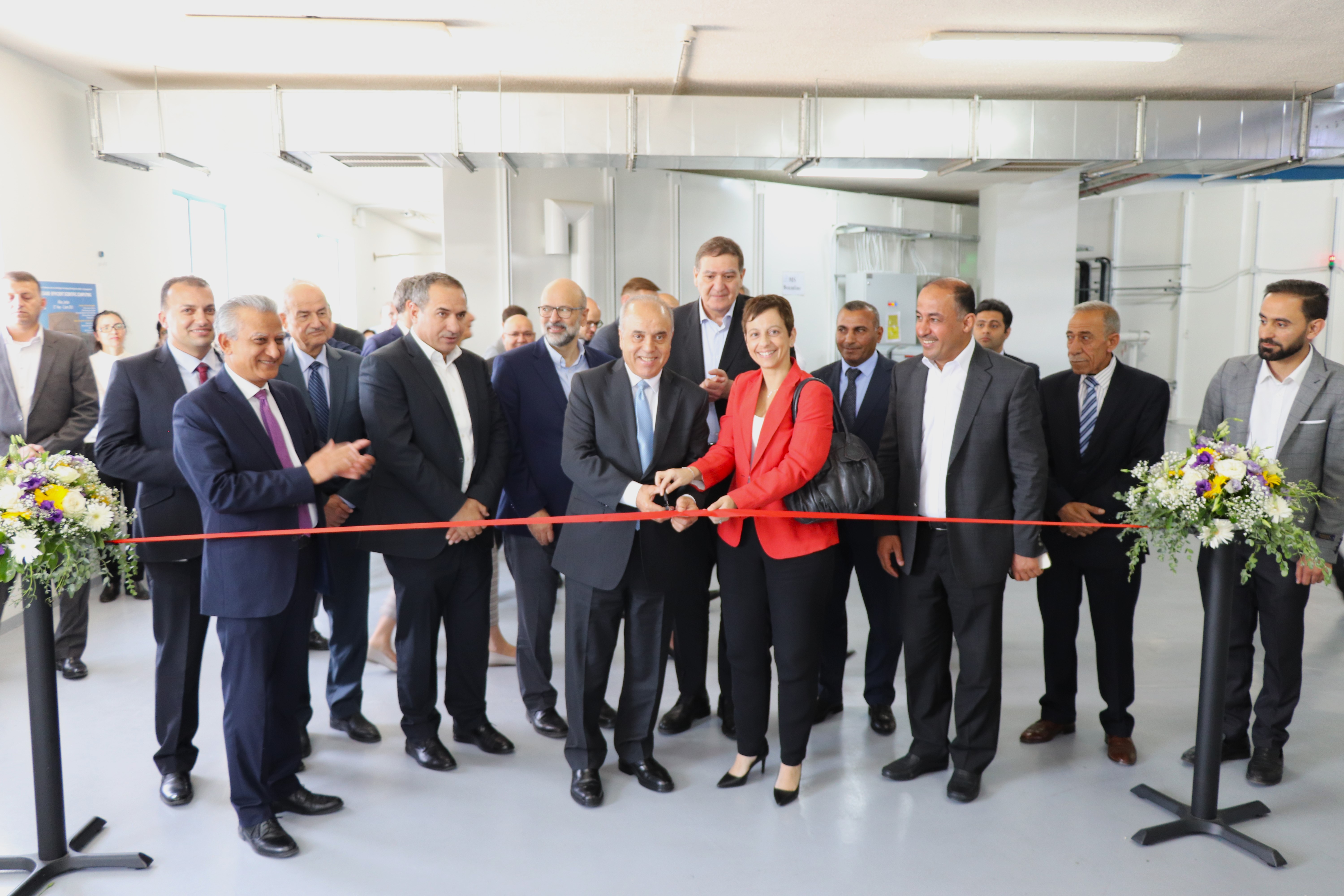 © SESAME 2023: Dignitaries formally inaugurate BEATS. Cutting the ribbon are (left to right):  Prof. Azmi Mahafzah, Minister of Higher Education and Scientific Research of Jordan, SESAME Director, Khaled Toukan and H.E. Ms Maria Hadjitheodosiou, Ambassador of the European Union to Jordan.