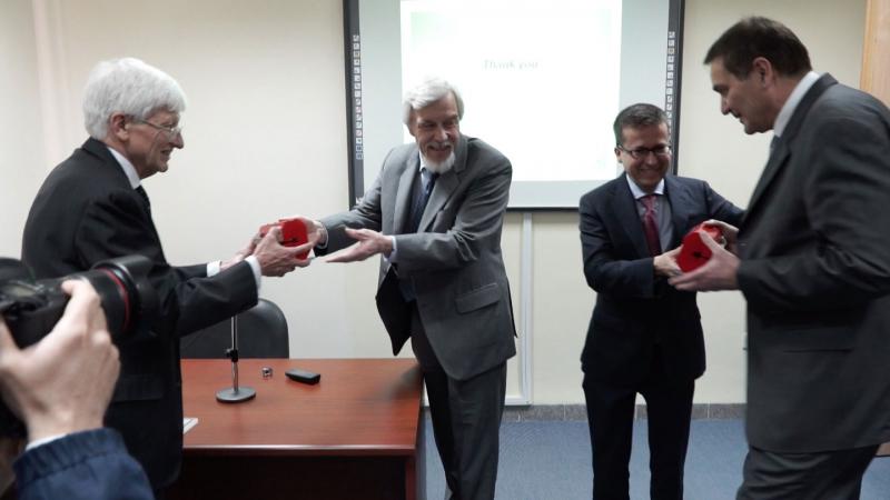Source of the image: © CERN | President of SESAME Council, Chris Llewellyn-Smith, receives half of the model SESAME magnet from CERN Director General Rolf Heuer, while European Commissioner for Research, Carlos Moedas, presents the other half to SESAME Director Professor Khaled Toukan